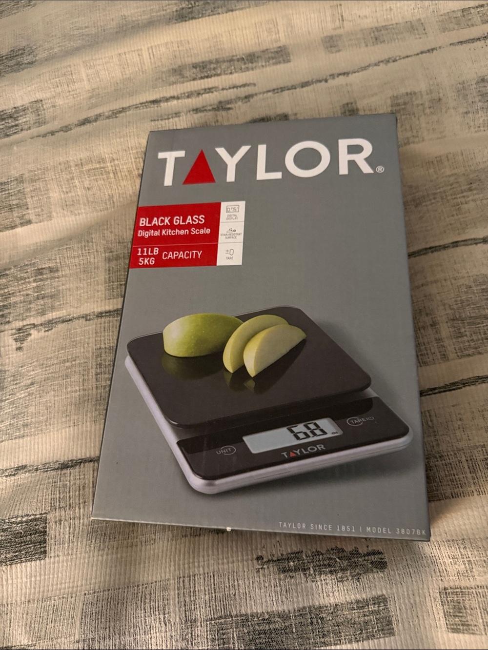 Taylor Black Glass Digital Kitchen Scale with Gray Packaging and Red Accent